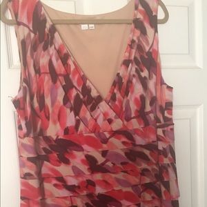 Surplice, sleeveless, layered dress.